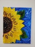 Sunflower half with shattered glass